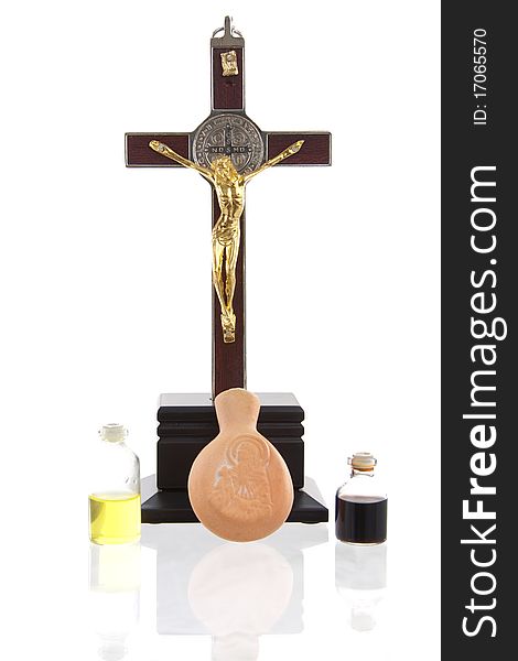 A photo of a statue of the cross of Jesus Christ and the materials that have been used on anointing his body. The photo was shut under studio lights. A photo of a statue of the cross of Jesus Christ and the materials that have been used on anointing his body. The photo was shut under studio lights.