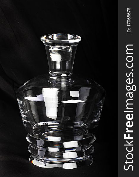 Empty crystal decanter with black background. Empty crystal decanter with black background