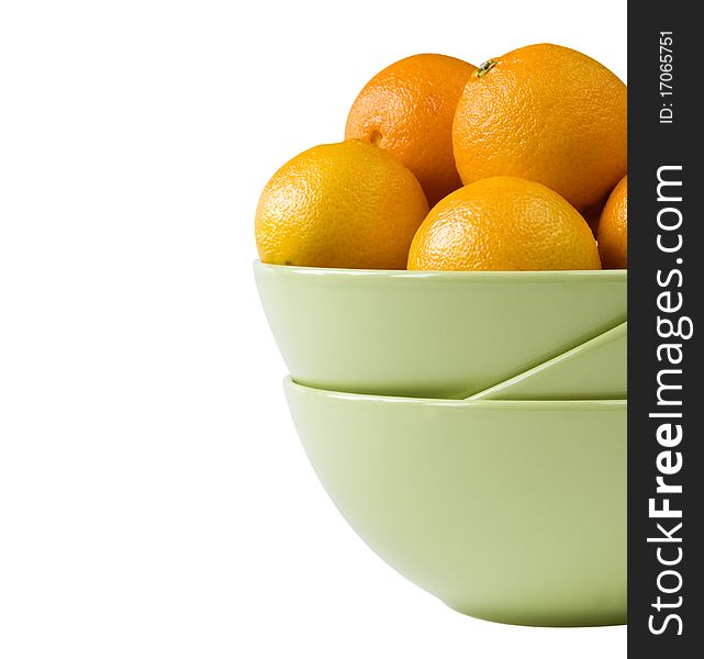 Part of a bowl with tangerines isolated on white