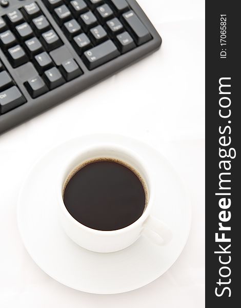 White Coffee Cup And Black Keyboard