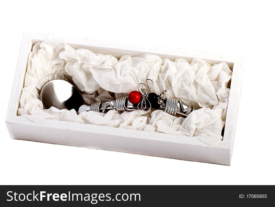 Decorative spoon in a box isolated on a white background