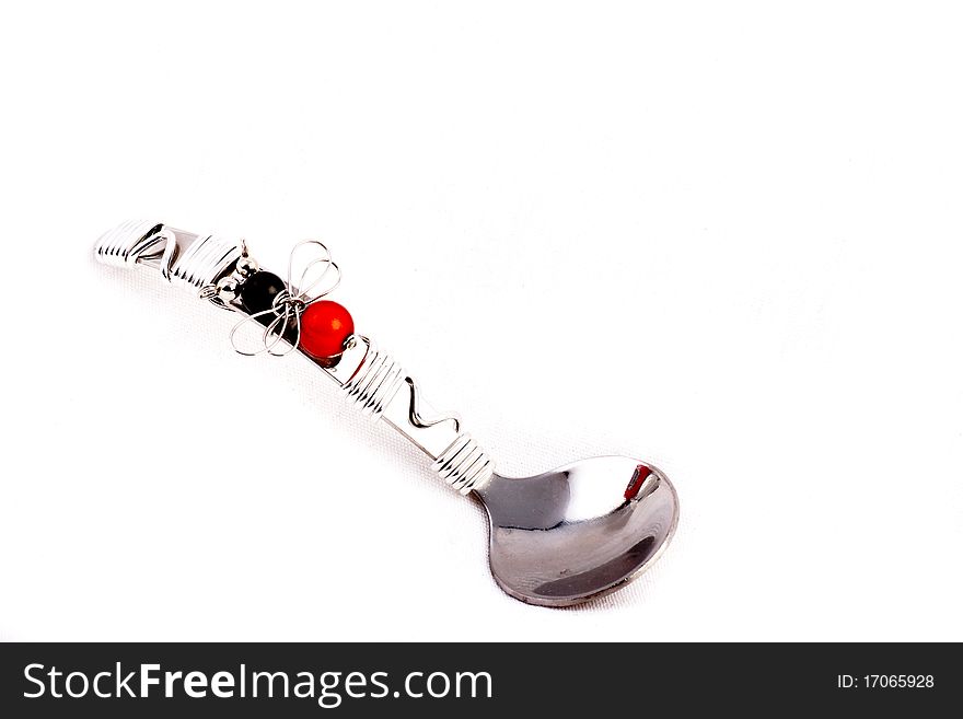 Silver decorative teaspoon isolated on a white background. Silver decorative teaspoon isolated on a white background