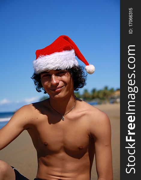 Santa claus on beach of Caribbean sea