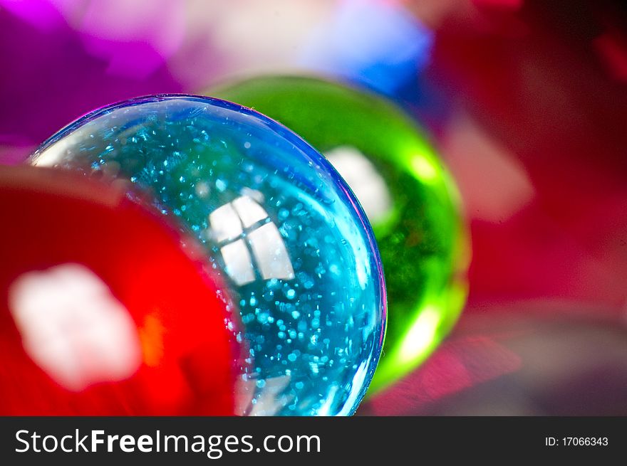 Marbles on colorfull blurred background