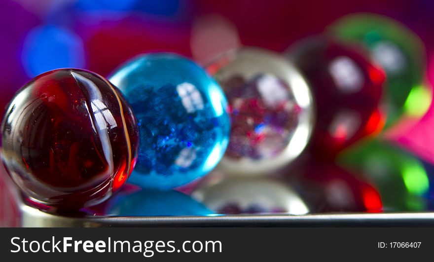 Marbles on colorfull blurred background