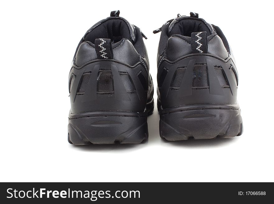 Black leather shoes on a white background