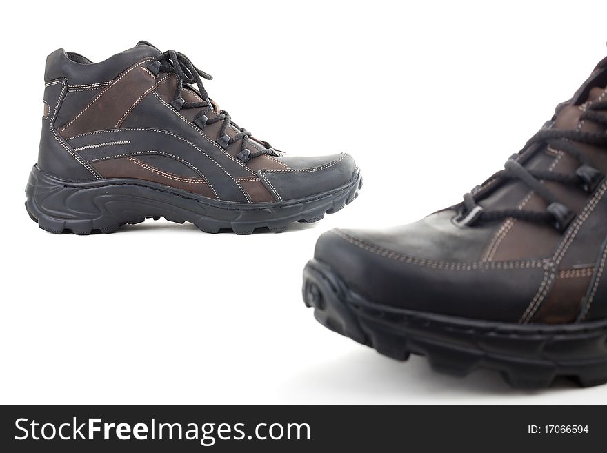 Black leather shoes on a white background