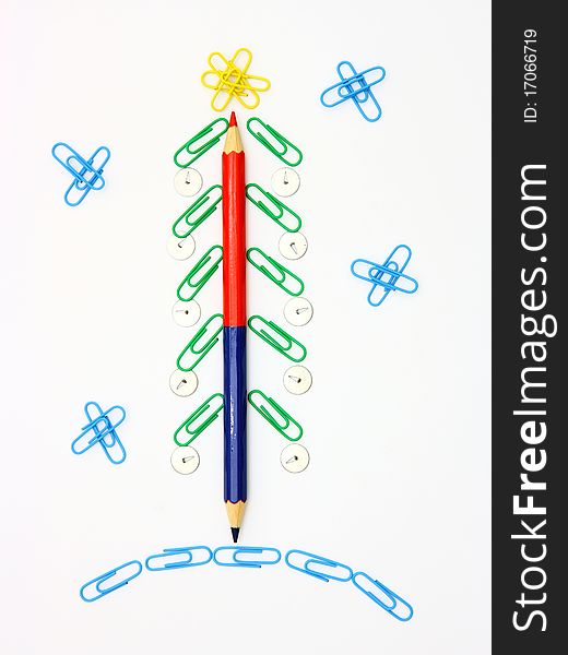 Christmas fur-tree from paper clips for a paper on a white background. Christmas fur-tree from paper clips for a paper on a white background