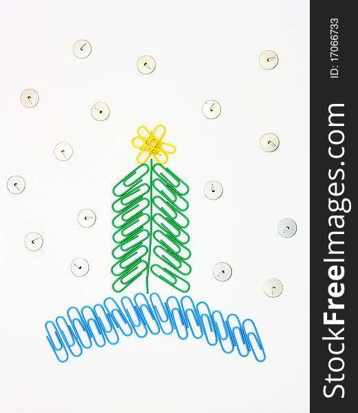 Christmas fur-tree from paper clips for a paper on a white background. Christmas fur-tree from paper clips for a paper on a white background