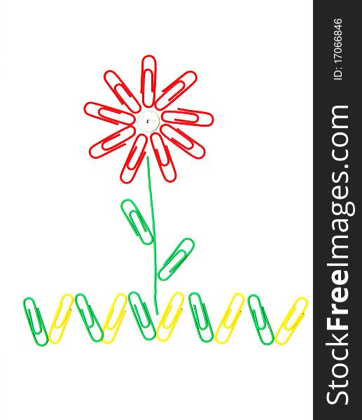 Beautiful flower on a grass from office paper clips for a paper. Beautiful flower on a grass from office paper clips for a paper
