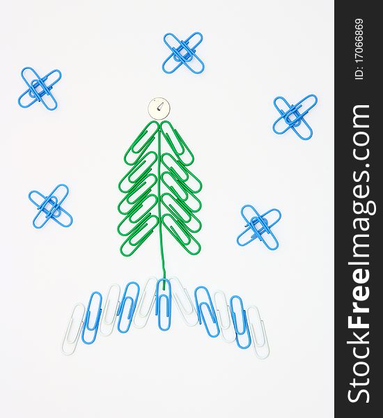 Christmas fur-tree from paper clips for a paper on a white background. Christmas fur-tree from paper clips for a paper on a white background
