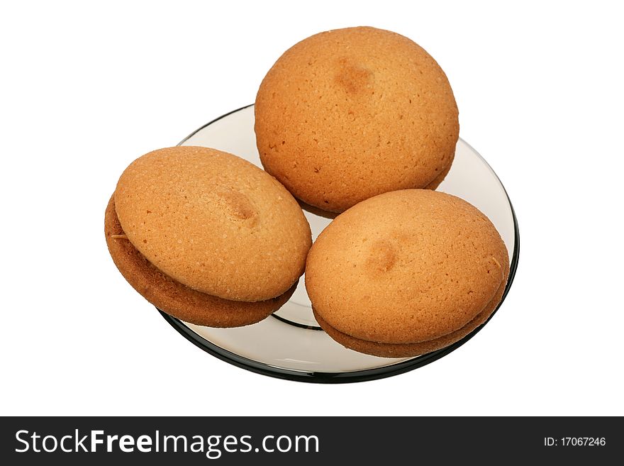 Tasty cookies on a glass plate over white background