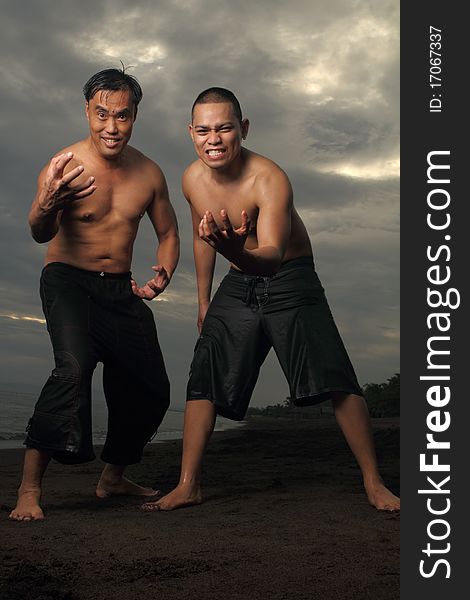 Asian male friends having fun at the beach. Asian male friends having fun at the beach