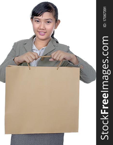 Asian woman holding shopping bag isolated over white background. Asian woman holding shopping bag isolated over white background