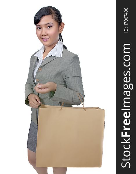 Asian woman holding shopping bag isolated over white background. Asian woman holding shopping bag isolated over white background