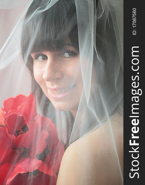 Soft and classic portrait of a smiling bride. Soft and classic portrait of a smiling bride
