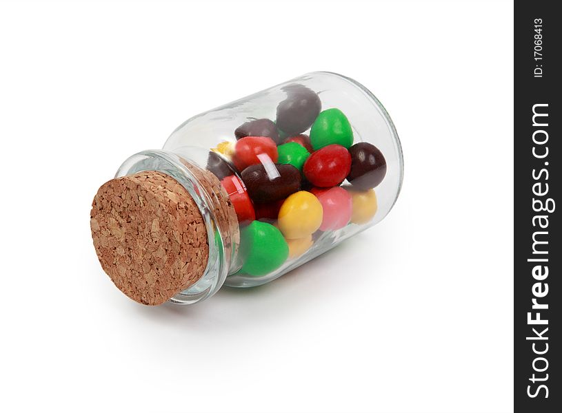 Multi-colored sweet sweets in a glass jar. Multi-colored sweet sweets in a glass jar