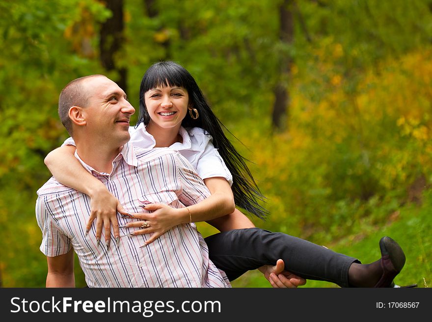 Young lovely couple have a fun in the park