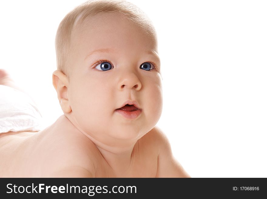 Portrait of pretty blue eyed baby boy on white background