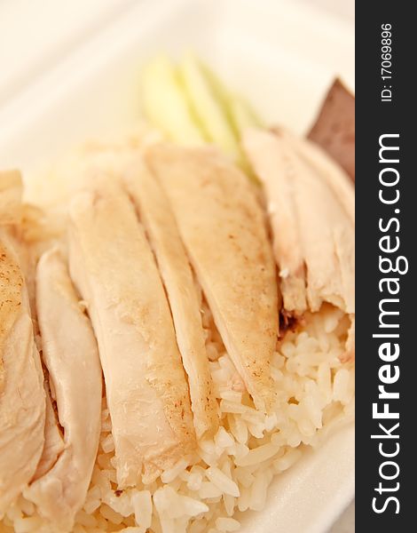 Boiled chicken on oily rice. Boiled chicken on oily rice