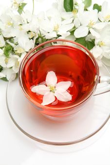 Mug With Tea And Flowers Stock Images