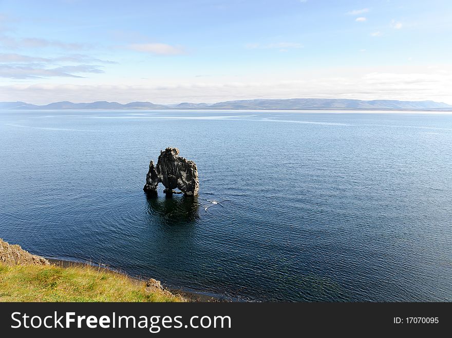 Monolith in the middle of the sea in Iceland. Monolith in the middle of the sea in Iceland