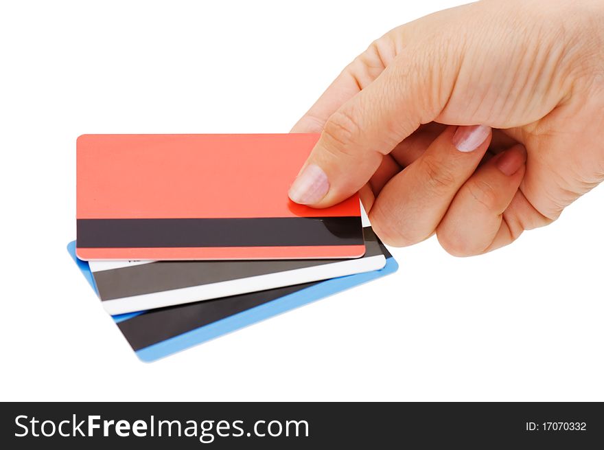 Credit card in a female hand isolated over white