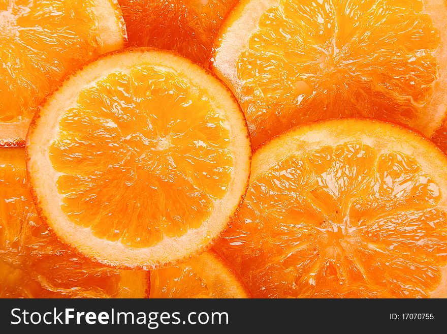 Bright, ripe oranges in syrup