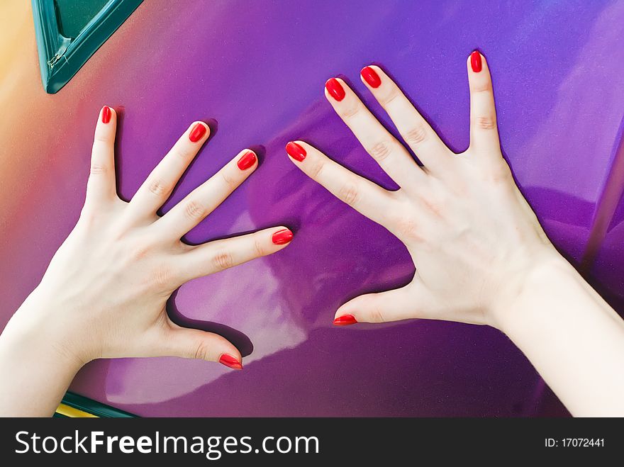 Two hands with with thumbs up on surface of car. Two hands with with thumbs up on surface of car