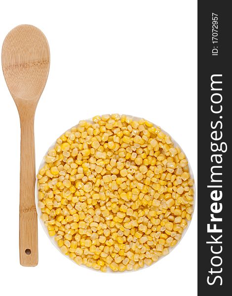 Canned corn in a circular plate on a white background.