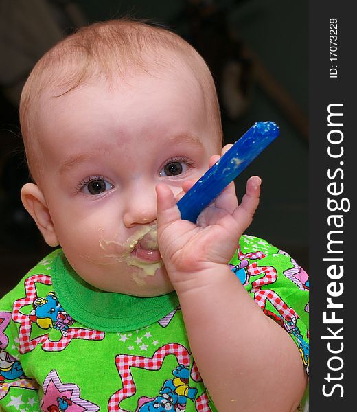 Photo of the eating boy with smile on face