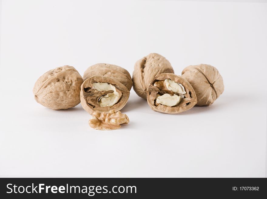 Group of dividet wallnuts isolated on a white background, horizontal version. Group of dividet wallnuts isolated on a white background, horizontal version
