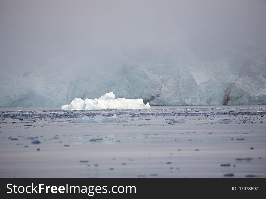 Arctic landscape - big glacier in the fog