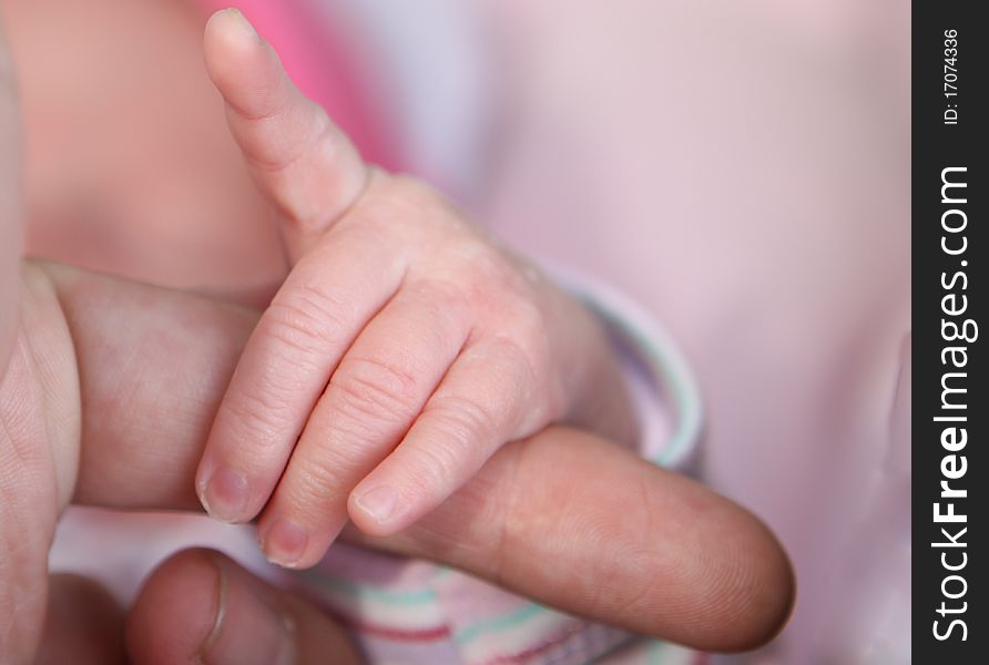 Newborn baby hand pointing with the finger. Newborn baby hand pointing with the finger