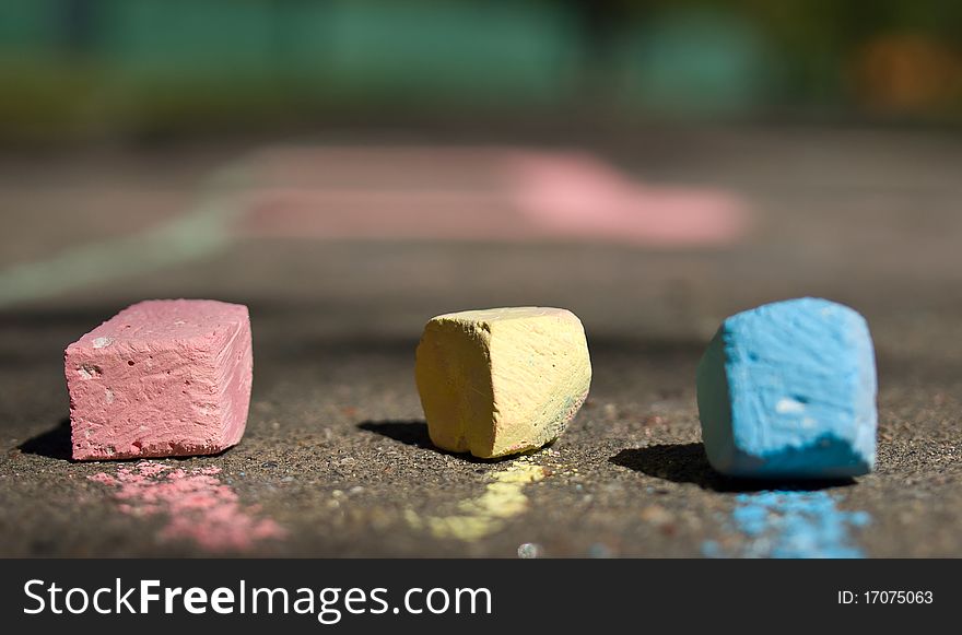 Colorful chalk on asphalt