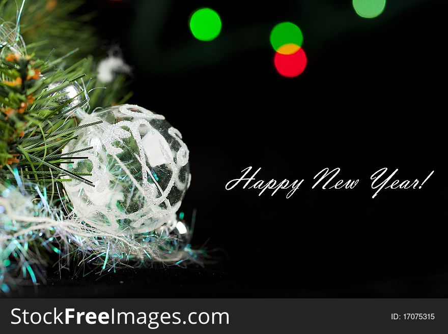 Transparent christmas ball with a christmas tree on the black background. Transparent christmas ball with a christmas tree on the black background