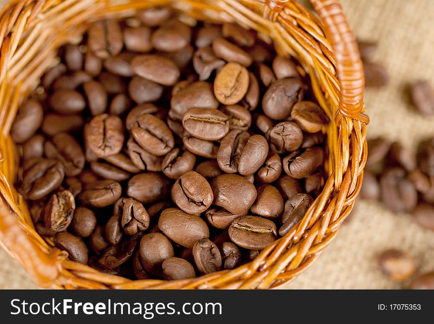Fragrant fried coffee beans on the little basket