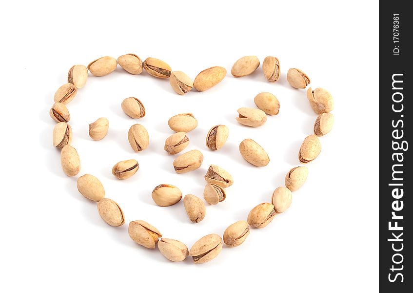 Heart of the pistachios on a white background