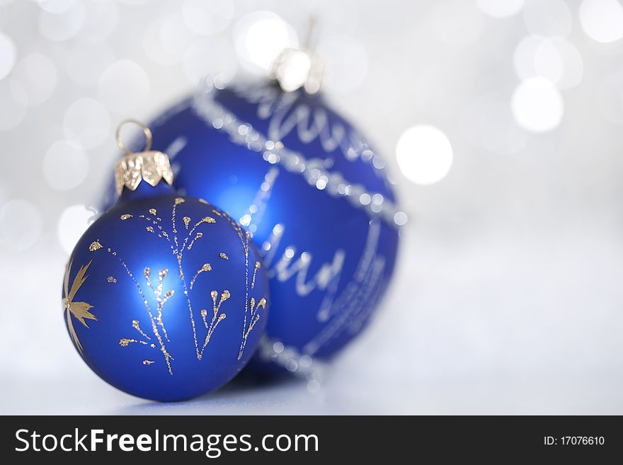 Blue christmas ball on abstract light background. Blue christmas ball on abstract light background.