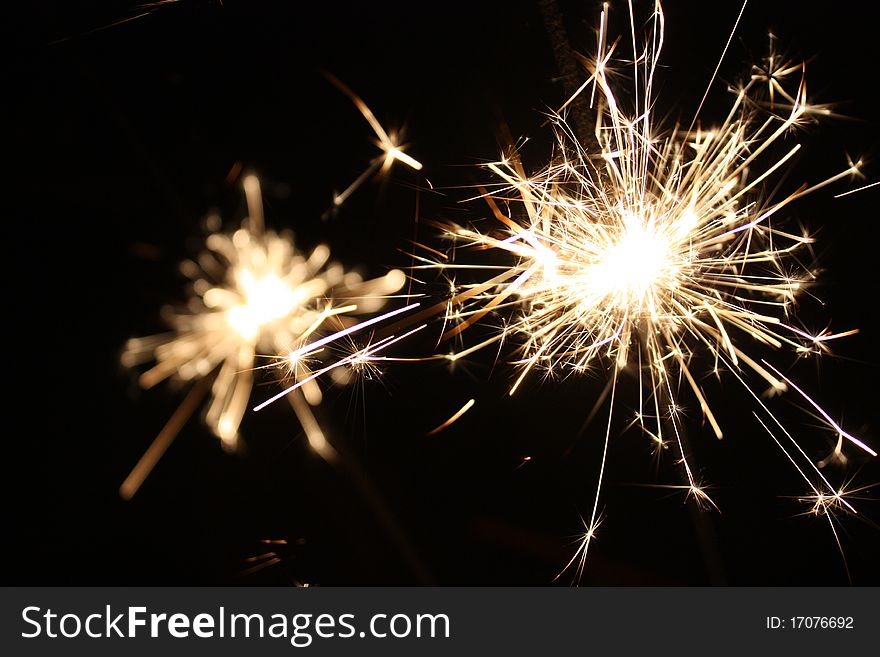 Burning sparkler on New Yearï¿½s Eve. Burning sparkler on New Yearï¿½s Eve