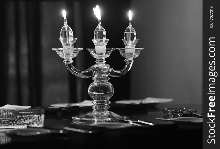 Candle lights on the table in the restaurant, b&w