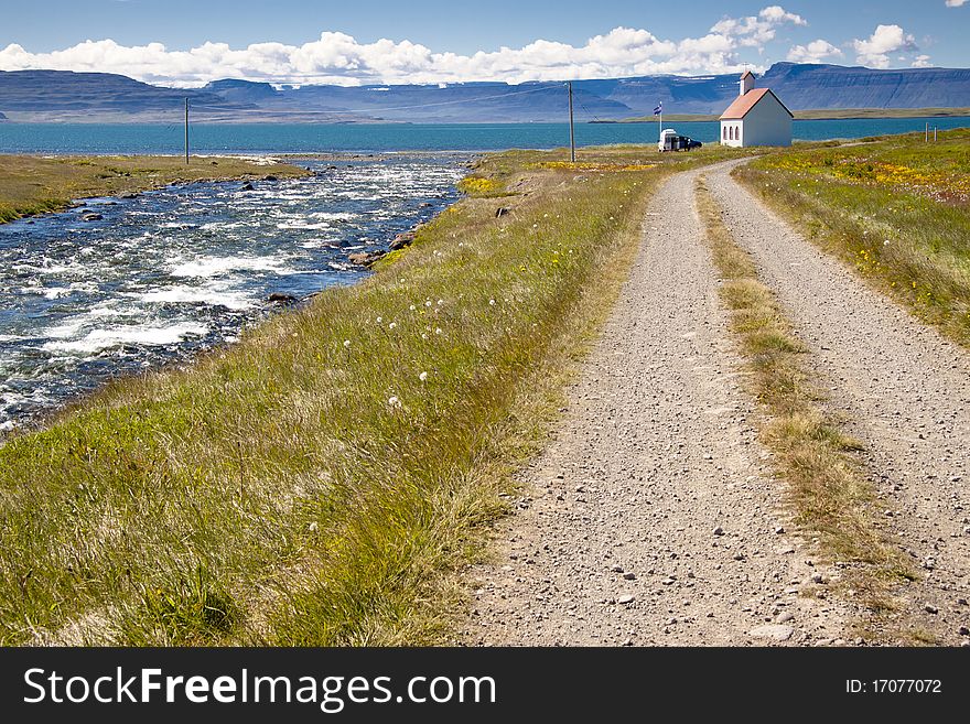 River, gravel route, old white church - Unadsdalur, Iceland. Summerday. River, gravel route, old white church - Unadsdalur, Iceland. Summerday