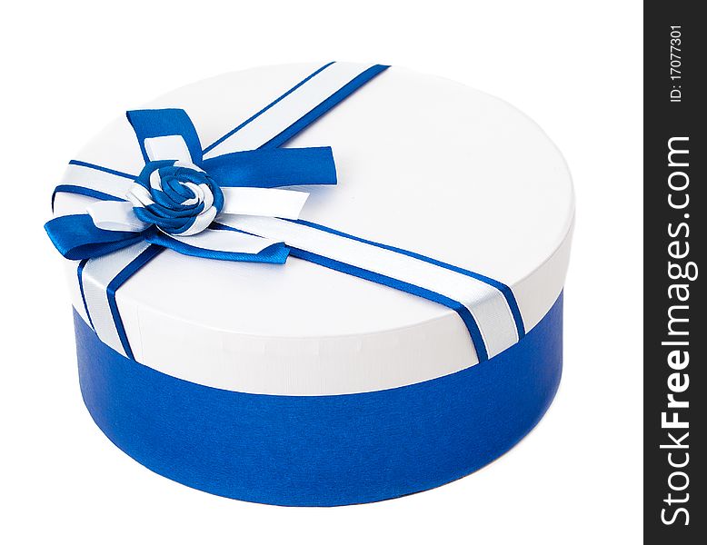 Round shape gift box with blue ribbon and bow isolated