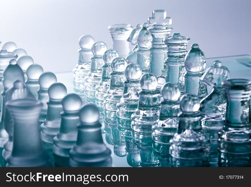 Transparent glass chess pieces in blue