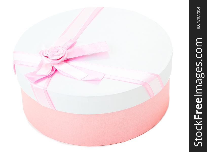 Round shape gift box with pink ribbon and bow isolated