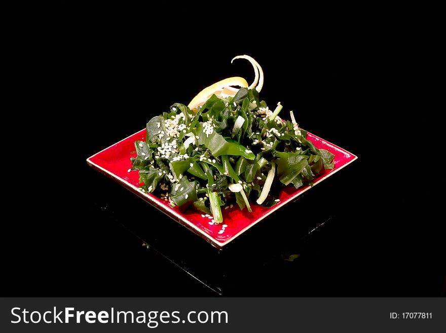 Salad on the black background