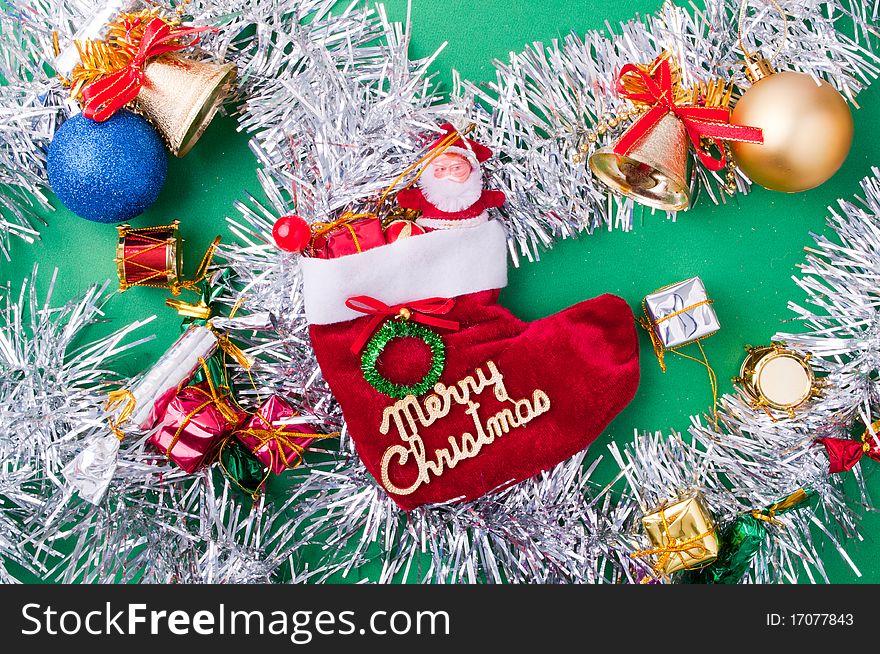 Christmas decoration objects on light green background. Christmas decoration objects on light green background