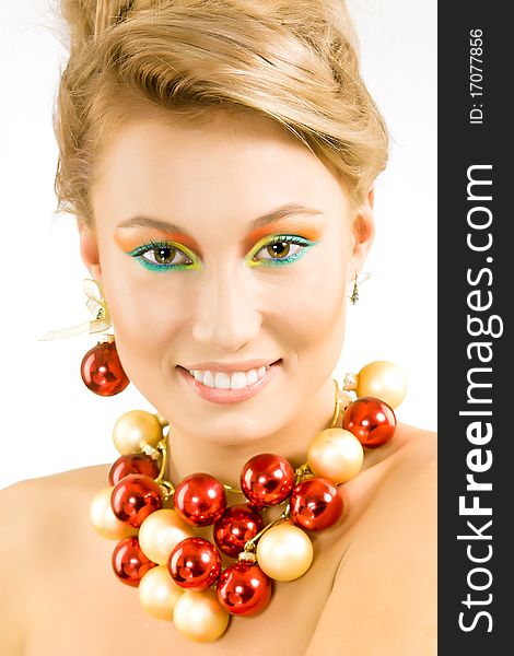 Attractive smiling young woman with necklace from xmas balls. Attractive smiling young woman with necklace from xmas balls