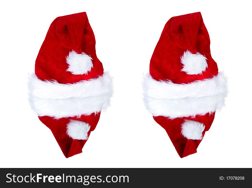 Two santa's hats reflected on the mirror