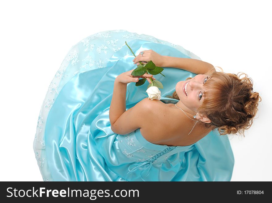 Female model wearing a dress, holding a white rose. Female model wearing a dress, holding a white rose